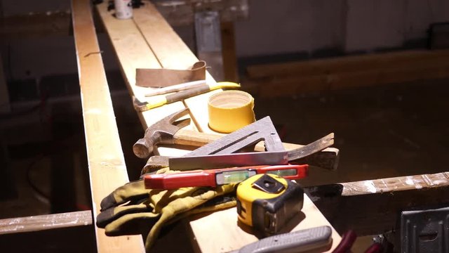 Camera Pans To Professional Contractor Work Bench In Basement Worksite