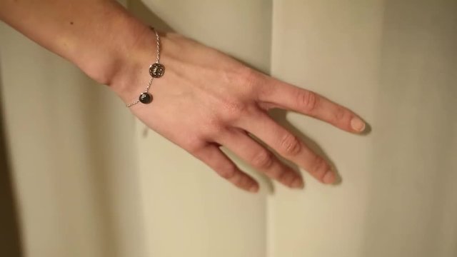 The girl played with curtain near window. Hand closeup. Pld House in Poland.