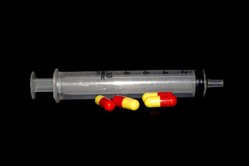 syringe isolated on black background