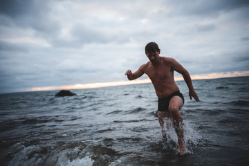 Man Wades in Ocean