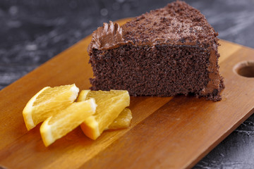 Slice of cake and orange slices.