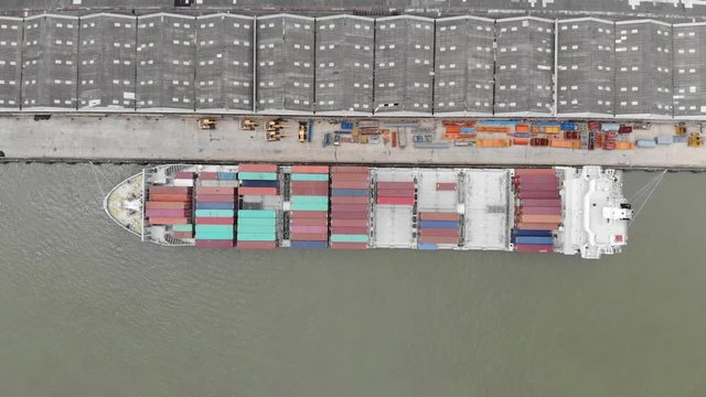 Bird's-eye view from drone of sea freight, Business International trade and Cargo containers on export-import harbor to the International port / Cargo ship - Cargo to harbor