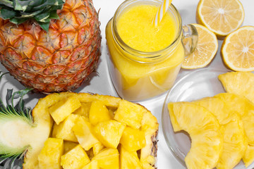 Still life. Pineapple juice, cocktails with fresh pineapple for breakfast in the morning on a white background. Detox. For health and for weight loss.