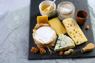 cheese board, cheese with blue mildew, Camembert or brie cheese circle, Cheese Serving Knife. top view image with copy space, set