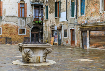 Fototapeta na wymiar Old square in Venice Italy after the rain