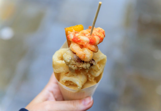 Fototapeta Italian street food in Venice - fritto misto in a cone
