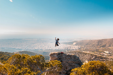 Young, wild and Free. Jumping on top of the world. Adventure in Greece