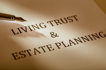 Fountain Pen Lying on the "Living Trust and Estate Planning" -
