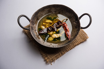 chaunk / Tadka / Tempering spices also known as baghaara, fodni, tarka or vaghaar. Typically prepared in Iron Karahi/kadhai. selective focus