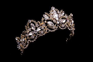 gold diadem with diamonds isolated on back - 219235911