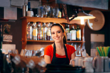 Cheerful Female Bartender Working Behind the Counter
