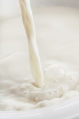 Fototapeta na wymiar Close-up of Pouring Milk