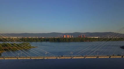 Aerial view over footbridge over the Yenisei river Krasnoyarsk drone footage
