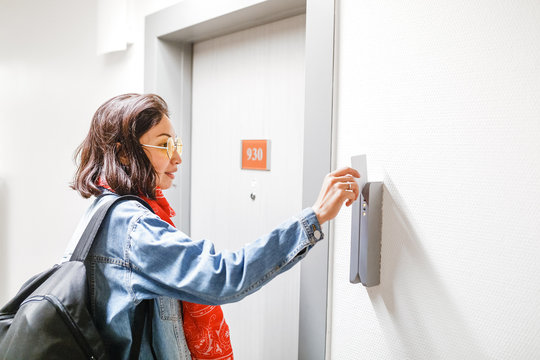 Woman open the Hotel door with electronic key card, access control system