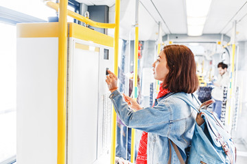 Woman buying ticket in tram or bus. public transport concept