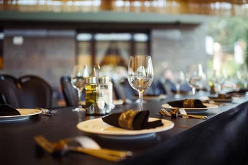 Fotobehang Kruidenier Sparkling glassware stands on long table prepared for wedding dinner  © maxbelchenko