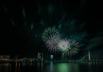 Magnificent fireworks over the River Daugava. Riga, Latvia. Long exposure. Copy space.