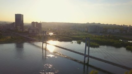 View over footbridge over the Yenisei river Krasnoyarsk drone footage
