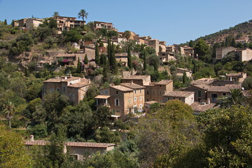 Fototapeta na wymiar Coastal village Deia at the road MA10 in Tramuntana Mountains on Mallorca 