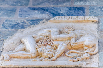 motifs from Greek mythology built into the wall 