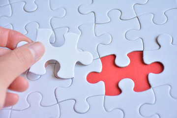 Jigsaw puzzle on a red background



