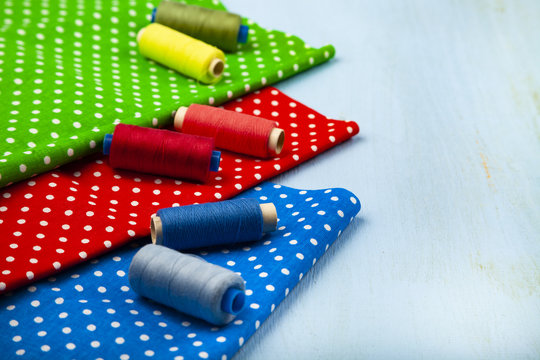 Coils with threads and multi-colored fabrics