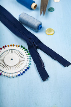 Sewing accessories on a blue  background