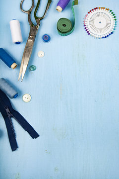 Sewing accessories on a blue  background