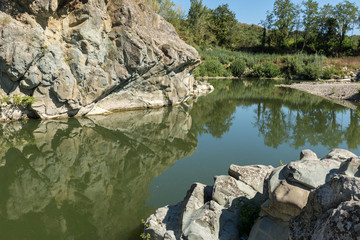 Fototapeta na wymiar rocks that are reflected in the water