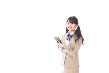 スマホアプリを使う制服姿の学生