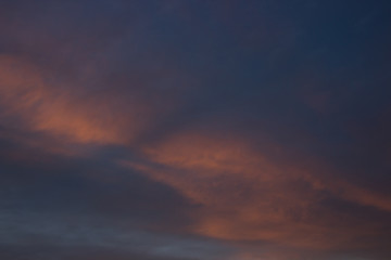 View on beautiful pink clouds in a pink blue sky.