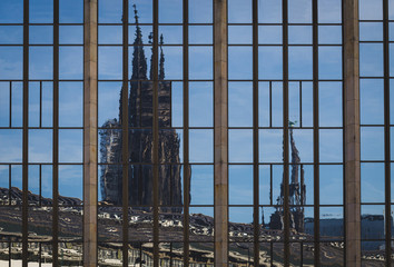 Reflection of the towers of Cologne cathedral against blue sky