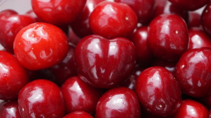 Beautiful shiny red cherries closeup