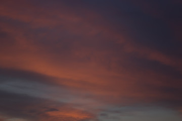 View on beautiful pink clouds in a pink blue sky.