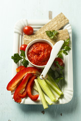 Roasted pepper dip with crisps and vegetables