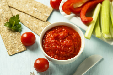 Roasted pepper dip with crisps and vegetables