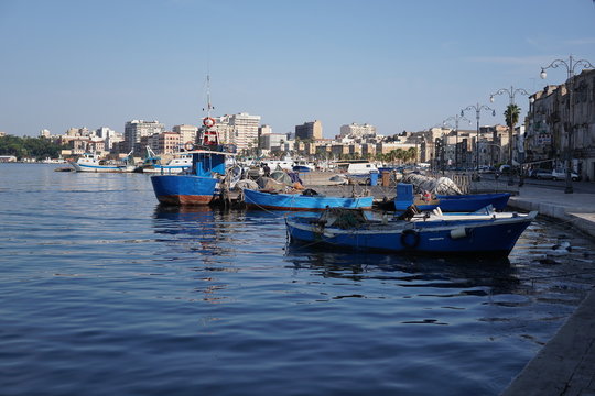 Fishing boats moored in the harbour of the Italian city Taranto