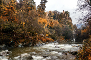 Mountain river in the Italian Dolomites, a beautiful stunning autumn landscape