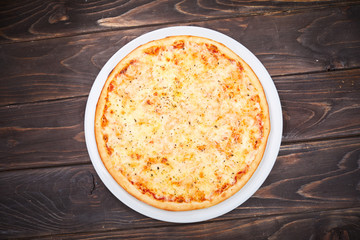 pizza on the wooden background