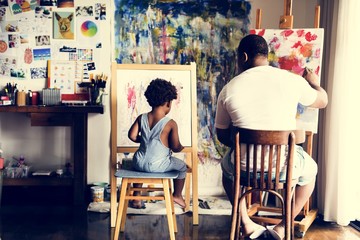 Artist family are painting in the living room - Powered by Adobe