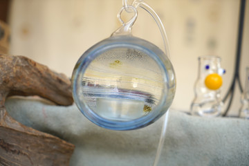 Ornate hand-blown glass balls in colorful colors with white glass
