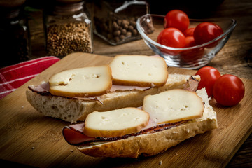 Sandwich with ham and smoked cheese.