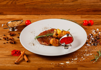 Dishes on a wooden table in white plates for a grill cafe