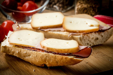 Sandwich with ham and smoked cheese.