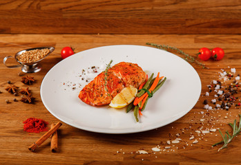 Dishes on a wooden table in white plates for a grill cafe
