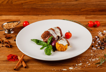Dishes on a wooden table in white plates for a grill cafe
