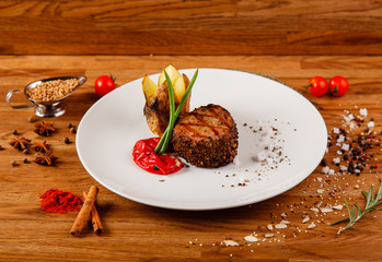 Dishes on a wooden table in white plates for a grill cafe