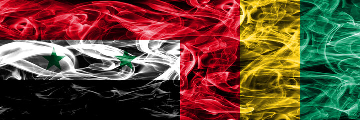 Syria vs Guinea smoke flags placed side by side. Thick colored silky smoke flags of Syrian and Guinea