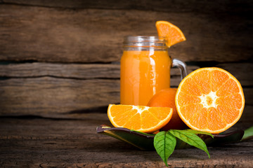 Orange Juice with Slice Fruit on Vintage Wood Table with Copy Space Background