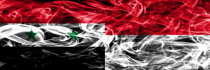 Syria vs Monaco smoke flags placed side by side. Thick colored silky smoke flags of Syrian and Monaco